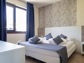 Arco Smart Hotel - Wohnbeispiel Doppelzimmer Gartenblick (Zimmercodierung DBG)