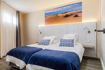 Corona Roja - Wohnbeispiel renoviertes Zimmer (Zimmercodierungen AB2 & OB2)