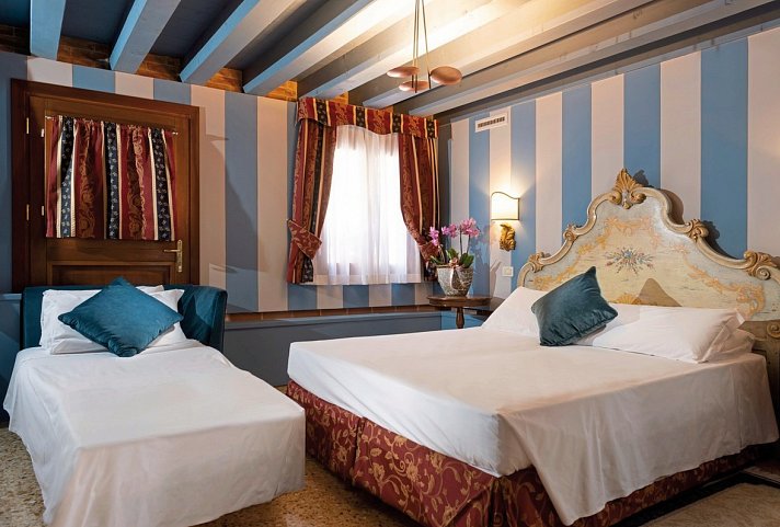 Hotel Tiziano - Wohnbeispiel Dreibettzimmer (Zimmercodierung TB1)